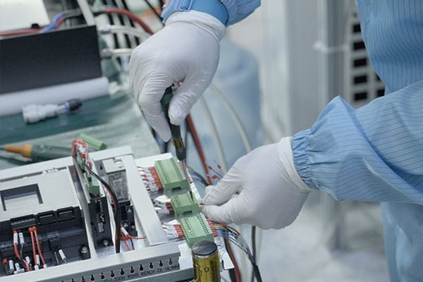 Technician adjusting laser module alignment at Vivlaser